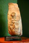 uxmal-museum serpent whose jaws gushes a face