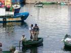 Volver a los pescadores en el puerto, Al Hoceima, Marruecos.
