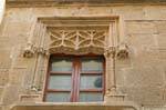Alghero, a través de Umberto, una ventana del Palazzo Machin, Cerdena.