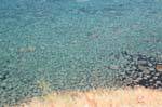 Aguas transparentes, costa Bosa en Alghero, Cerdena.