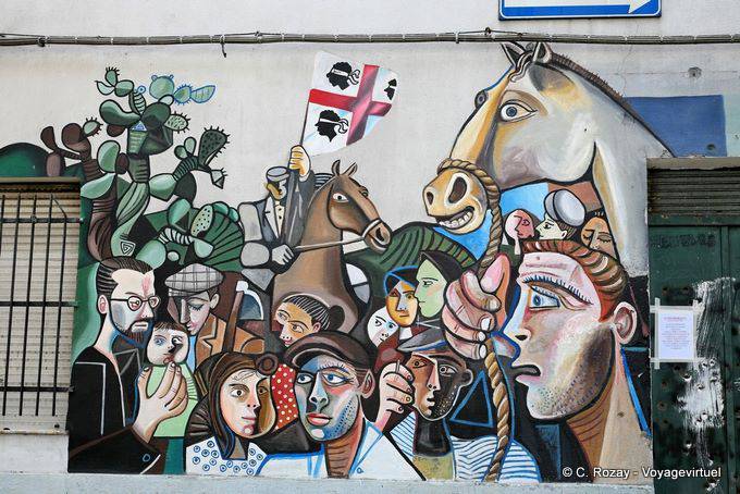 Orgosolo, caras y el mural de la bandera de Cerdeña - Cerdena