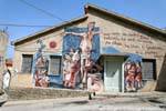 Orgosolo, Deus Bonu, mural en la fachada de una casa, Cerdena.